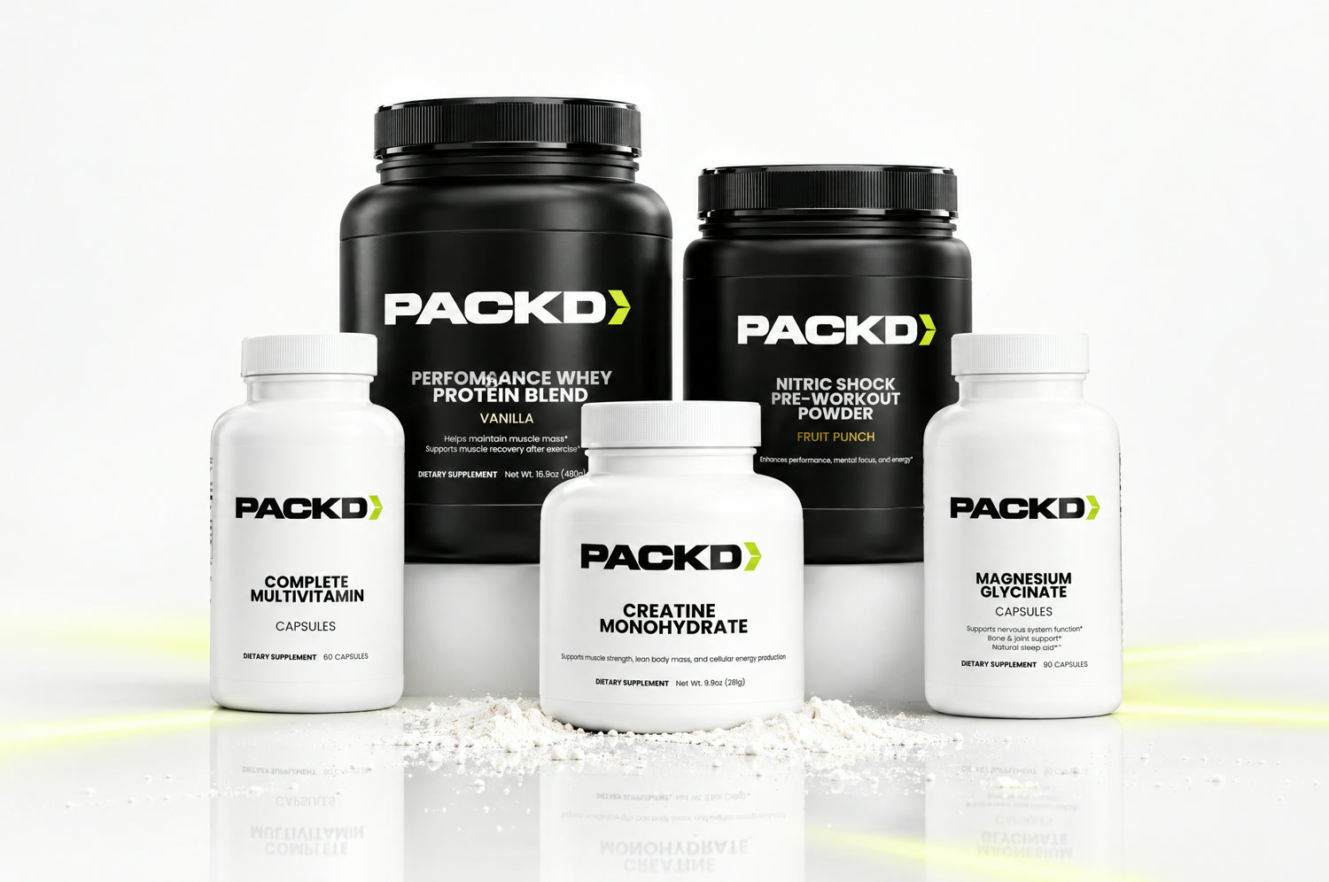 All five PACKD products together: whey protein, creatine, pre-workout, multivitamin, and magnesium.